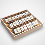 Glass spice jar set with bamboo lids, labels, and funnel